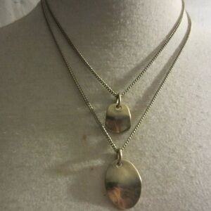 Kenneth Cole New York Two Layered Gold Tone
Hammered Pendant Necklace